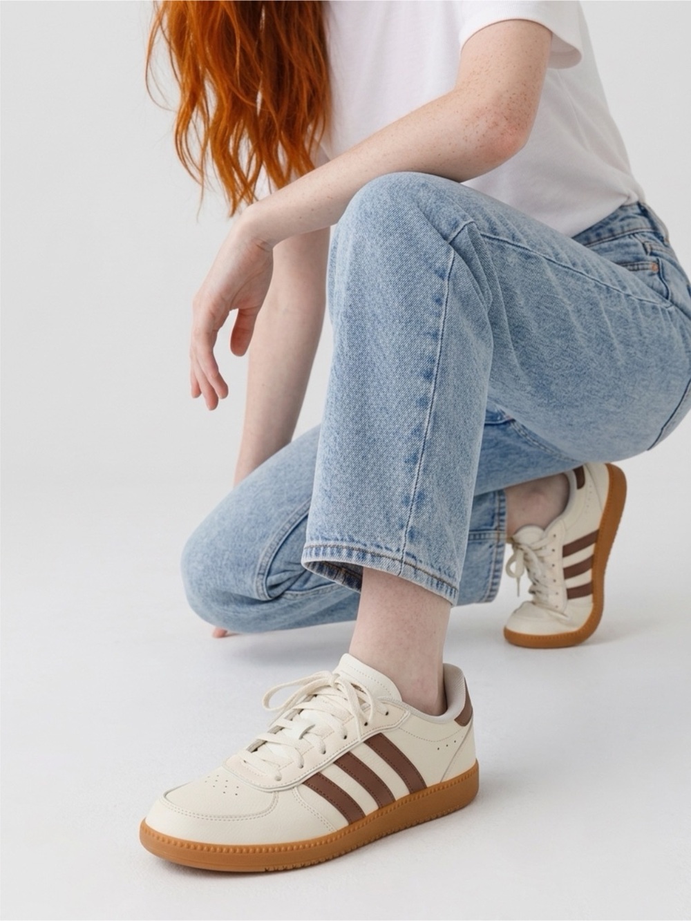 Adidas off white cloud foam plus sneakers with brown stripes